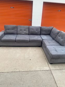 FREE DELIVERY!! Gray suede sectional with cup holder