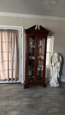 Curio cabinet and grandfather clock