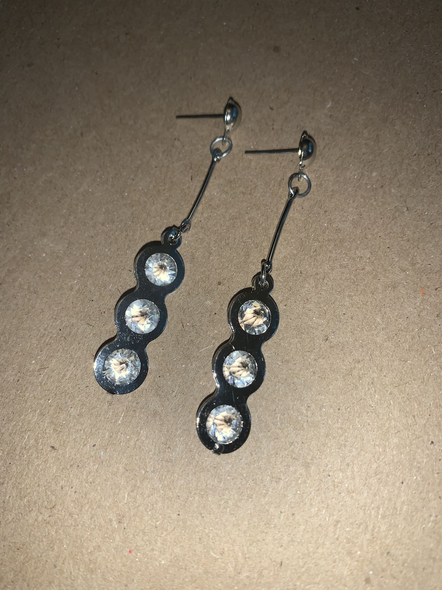 Three diamonds silvertone earring