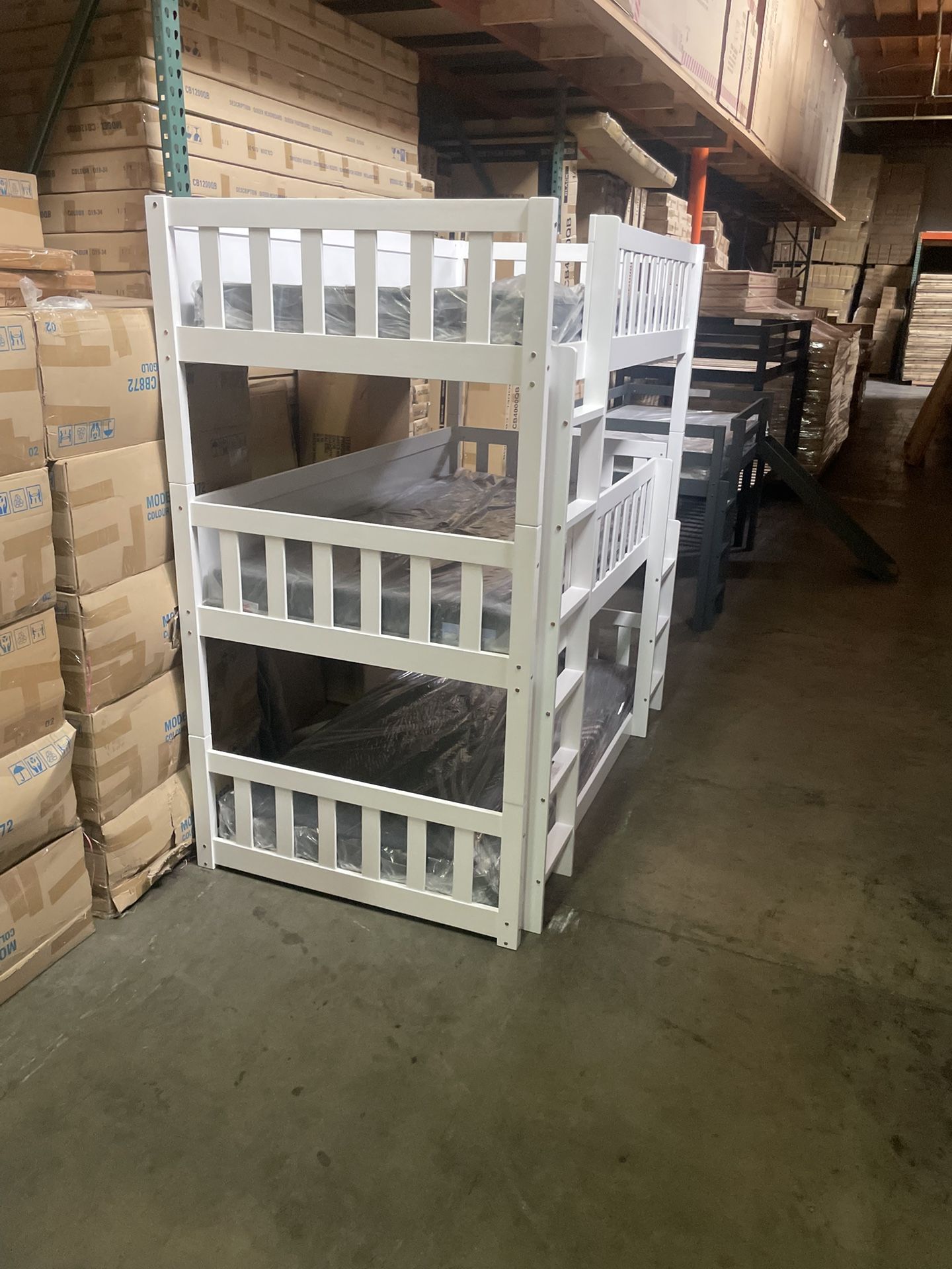 Triple bunk bed. Available in white & espresso. Assembly required. Assembly not included. Taxes included. Free delivery. Bunk bed only-$450 Bunk bed