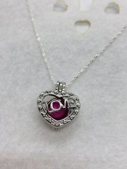 New Beautiful Dark pink Colored Rice Pearl in A Silver Heart love Pearl Cage Charm with 20 inch Sterling Silver Chain. Makes a beautiful Valentine