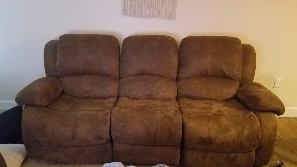 Brown sofa couch with reclining seats