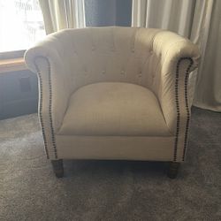Two Beige Chairs With Wood Legs 