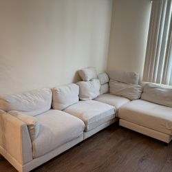 Beige Couch With Ottoman