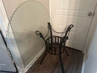 Hard Glass top dining table with 4 metal chairs .