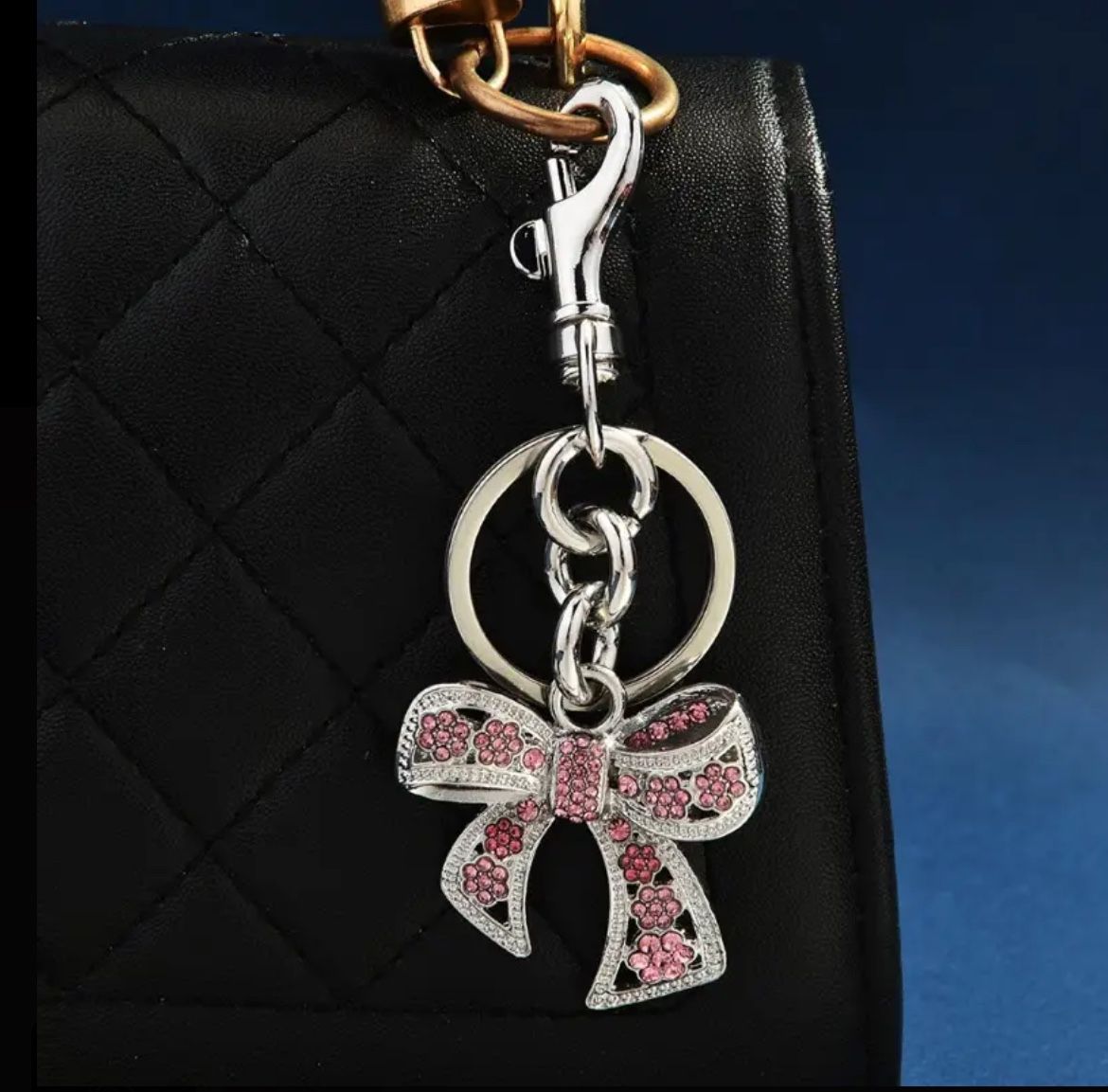 silver keychain with a pink bow design New In The Box