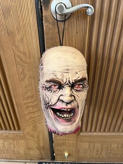 Spirit Halloween 2 sided head with staples  around it