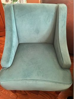 Elegant and comfortable teal armchair