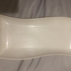 Elegant white serving platter with a wavy design