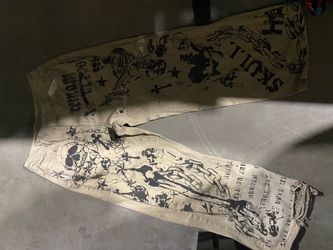 Baggy tan pants with skulls