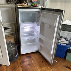 LG 6.0 Cubic Feet Mini Fridge. Small Ding On Door. 