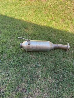 Toyota factory original (OEM) exhaust resonator assembly.