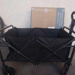 NEW Never Used. Folding Wagon 2.  1/2 Feet Long X 1. 1/2 Feet   Can  Put 150 Lbs. For $60