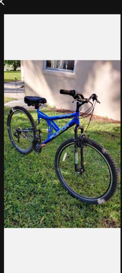 Kent Flexor 29 inch Dual Suspension Mountain Bike. 21 speed Shimano gear. 2 disc brakes. Padded seat