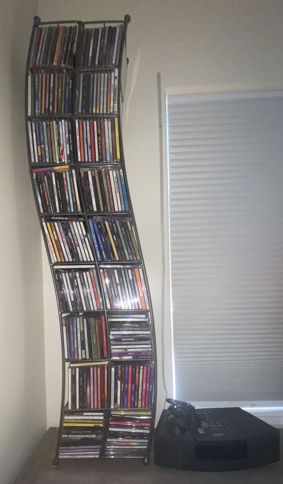  3 PIECE BUNDLE DEAL LOT/1- BOSE FM/AM CD PLAYER STEREO/1-METAL CD TOWER RACK, AND A LITTLE OVER 250 FULL TRACK CDS OF DIFFERENT MUSIC GENRE.