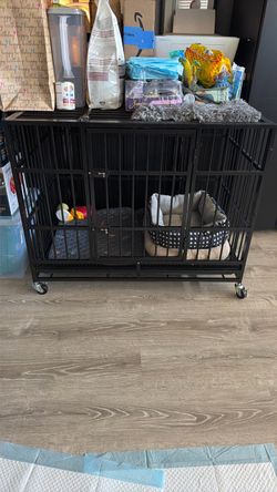 Collapsible metal crate with wheels for small/medium dog. New condition