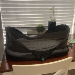 Portable infant bed  