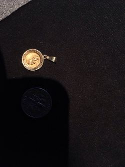 Gold religious charm