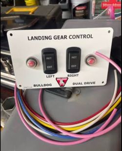 Bulldog landing gear controls include a variety of wired switch panels tandem electric trailer jacks. Standard systems utilize a heavy-duty, weather-p