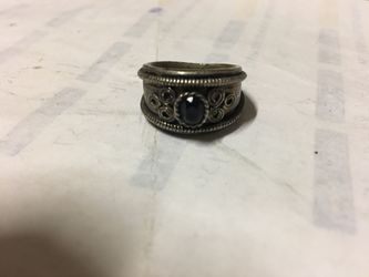 Silver Ring black cut on it