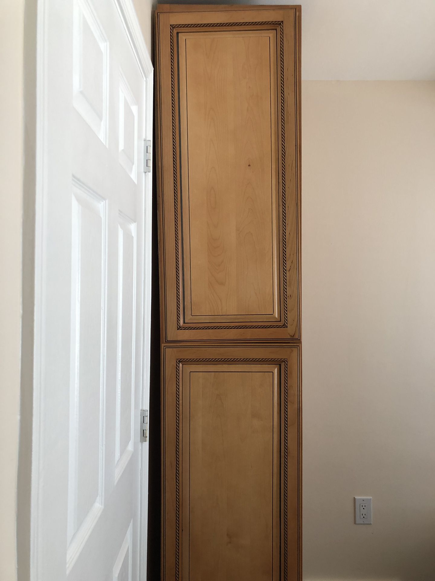 Wooden cabinet, tall, intricate detail. Never used, shelves included. Width front to back 24inchs. Width across front 17.5inches. Height 92.5inches