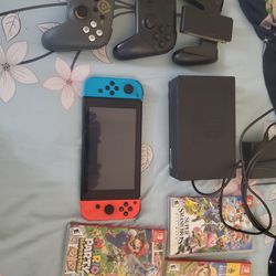 Nintendo switch console with controller and games