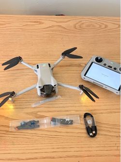 DJI Mini 3 Drone + DJI RC Controller + Case & Accessories