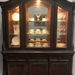 China with matching dining set. Adjustable length includes 8 chairs from Ashley Furniture