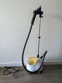 Standing garment steamer on wheels