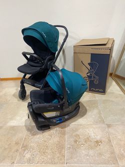 Nuna Mixx Next stroller with car seat green canopy
