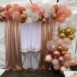 Balloongarland——-draping——-tablecloth——-chairs——-table——-resinchairs———