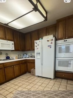 White Side-by-Side Refrigerator with Ice Dispenser