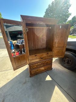 Big wood closet cabinet in good condition for 120 or best offer