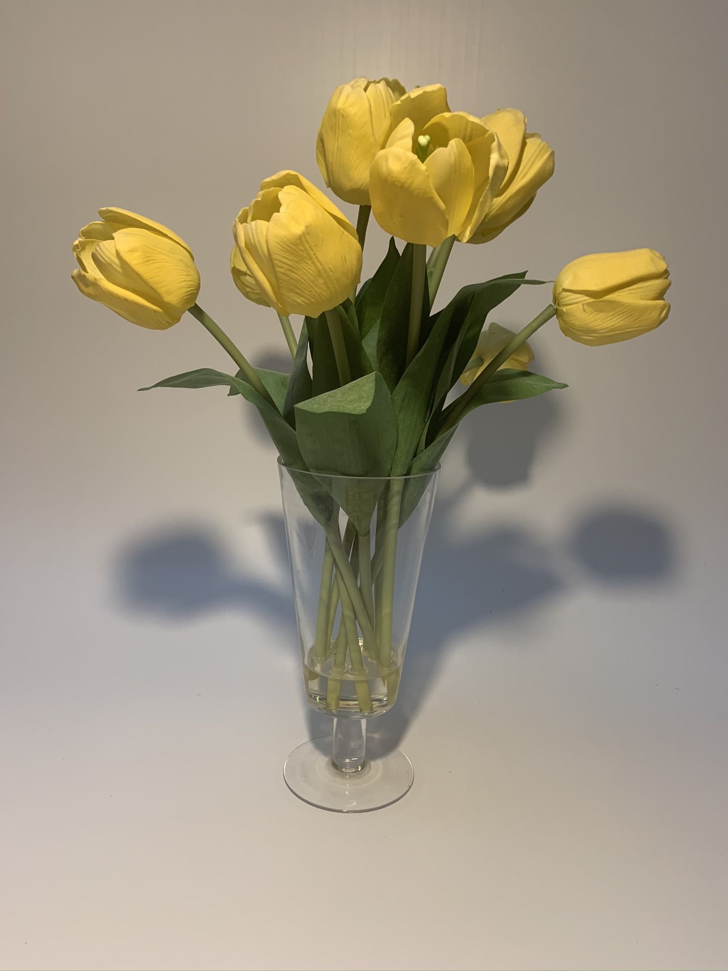 Artificial flowers - yellow tulips in a vase