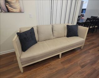 Cream Upholstered Sofa with Wood Frame
