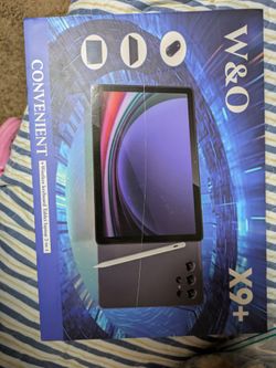 W & 0 tablet, new, comes with bluetooth mouse, earbuds, stylus, and case that covers front and back, preinstalled glass screen protector, coral colore