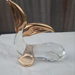 Vintage hand blown glass whale figurine with gold color accents. 