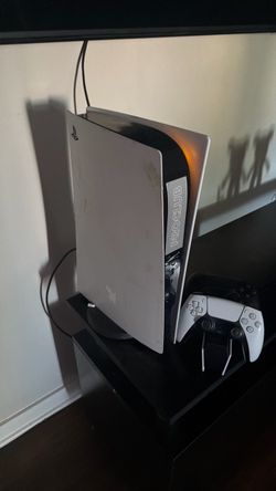 play station 5 (ps5) 2 controllers and a controller charger great condition