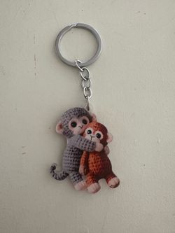 Cute “Punch” hughing monkey key chain