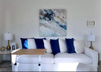 White Sofa With Blue Cushions