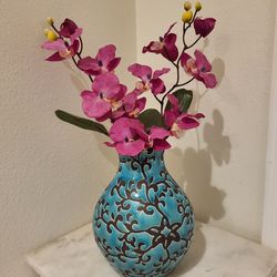 Hobby Lobby Turquoise Vase with Brown Floral pattern 
Round ceramic vase with turquoise glaze.