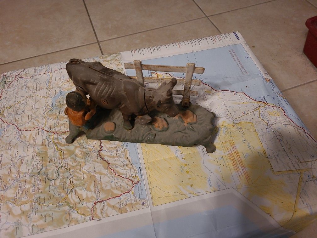 Cast Iron Farmer Milking Cow