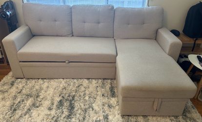 Tan sectional sofa with chaise and sofa bed