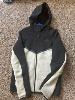 black and grey Nike tech