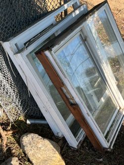 Vinyl windows w screens and solid wood door