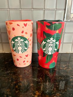 Two Starbucks mugs