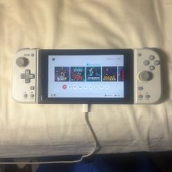 Pre-Owned Nintendo Switch; Excellent Condition. Pre-loaded With Numerous Games