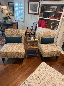 Two elegant cream and beige slipper chairs