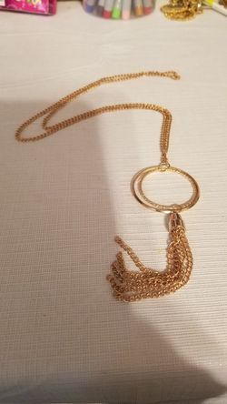 Gold tone long chain tassel ring pendant necklace