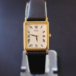 VTG Seiko 2Y00-5000 Gold Tone White Dial Roman Numerals Tank Watch Runs FLAW